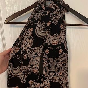 Free people jumpsuit has been slightly altered with a lace up back.